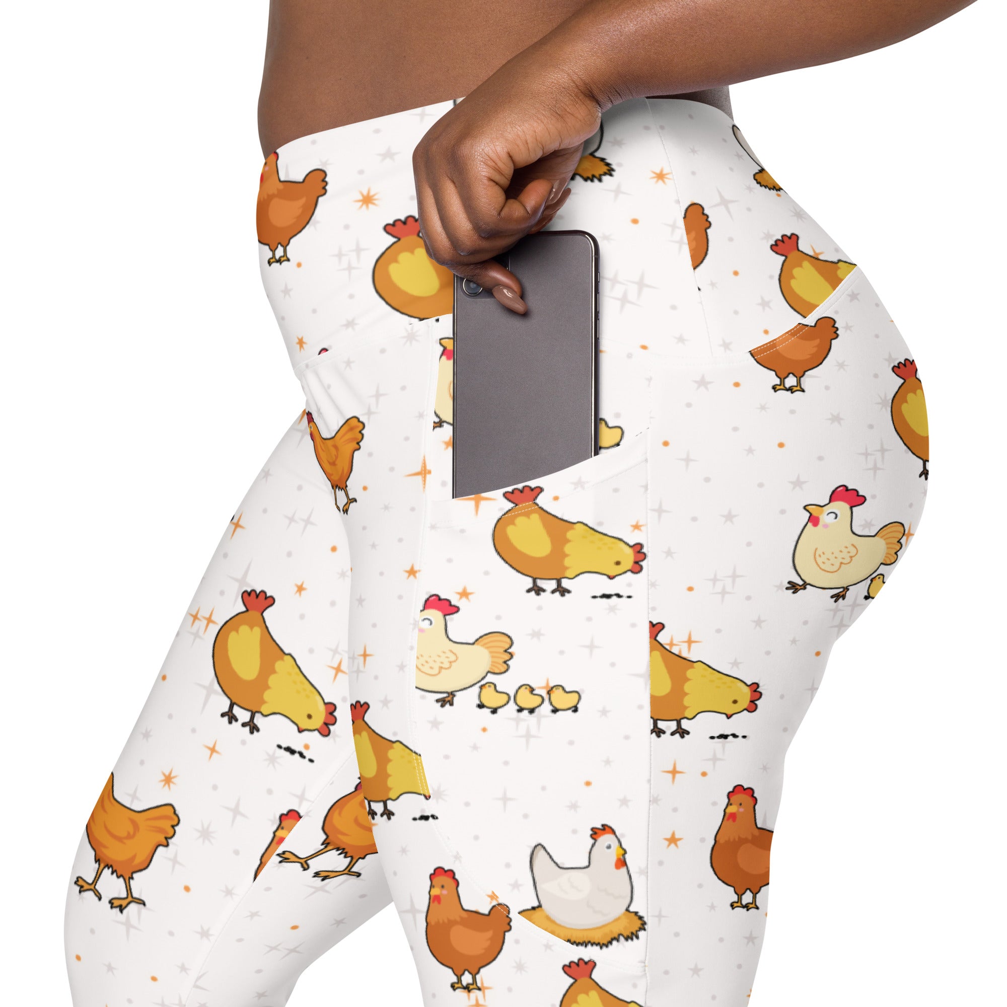 White women’s high-waisted chicken yoga leggings with pockets featuring orange yellow chickens on soft compression fabric