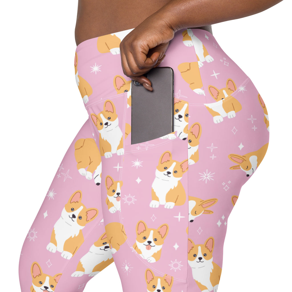 Women’s pink high-waisted corgi dog yoga leggings with pockets featuring orange and white playful pattern and starbursts
