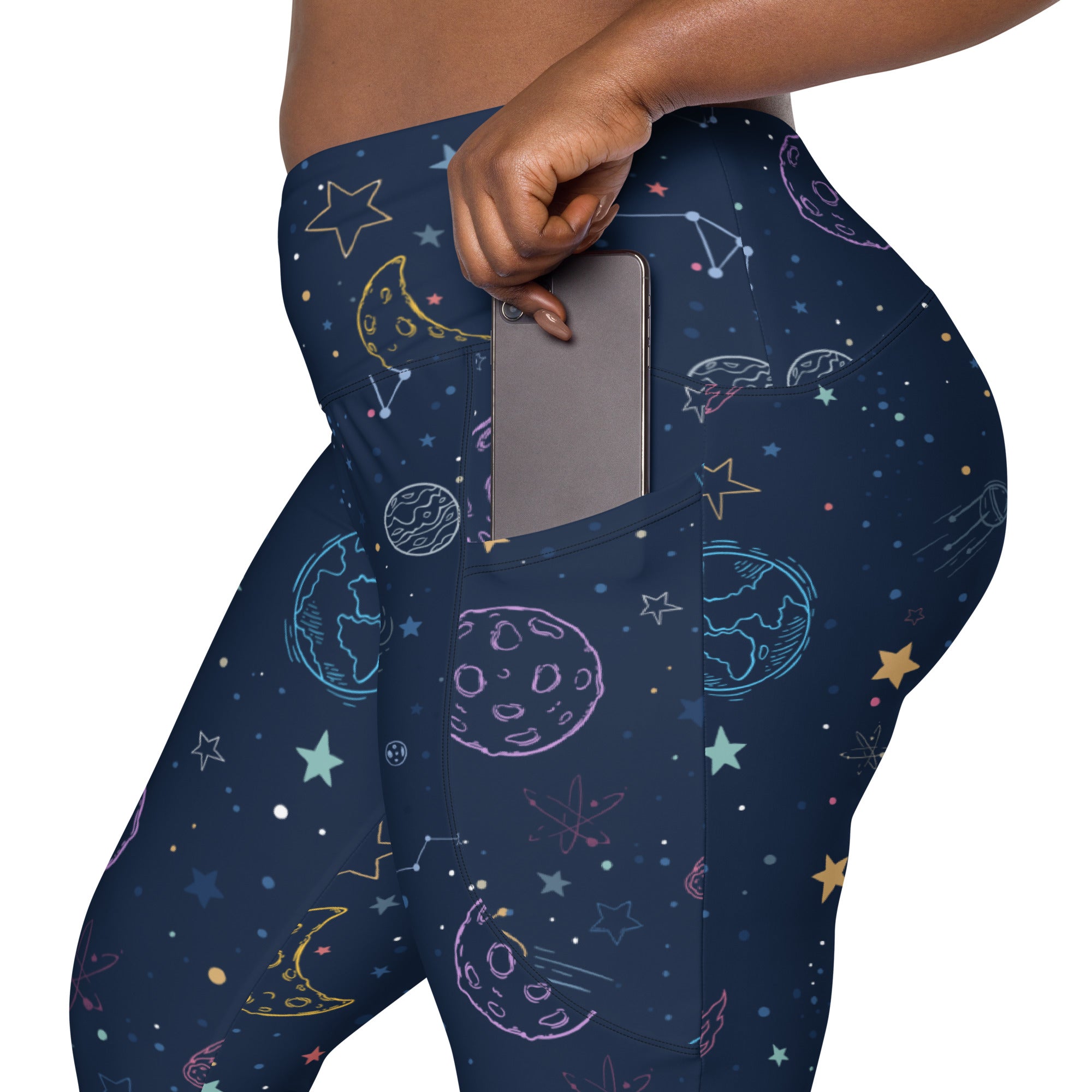 Women’s high-waisted dark blue galaxy space leggings with neon pink yellow cyan celestial prints and pockets for yoga