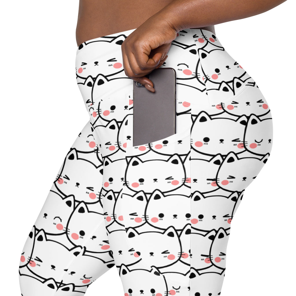 Women’s white high-waisted kawaii cat face yoga leggings with pockets featuring black-outlined cats with pink cheeks