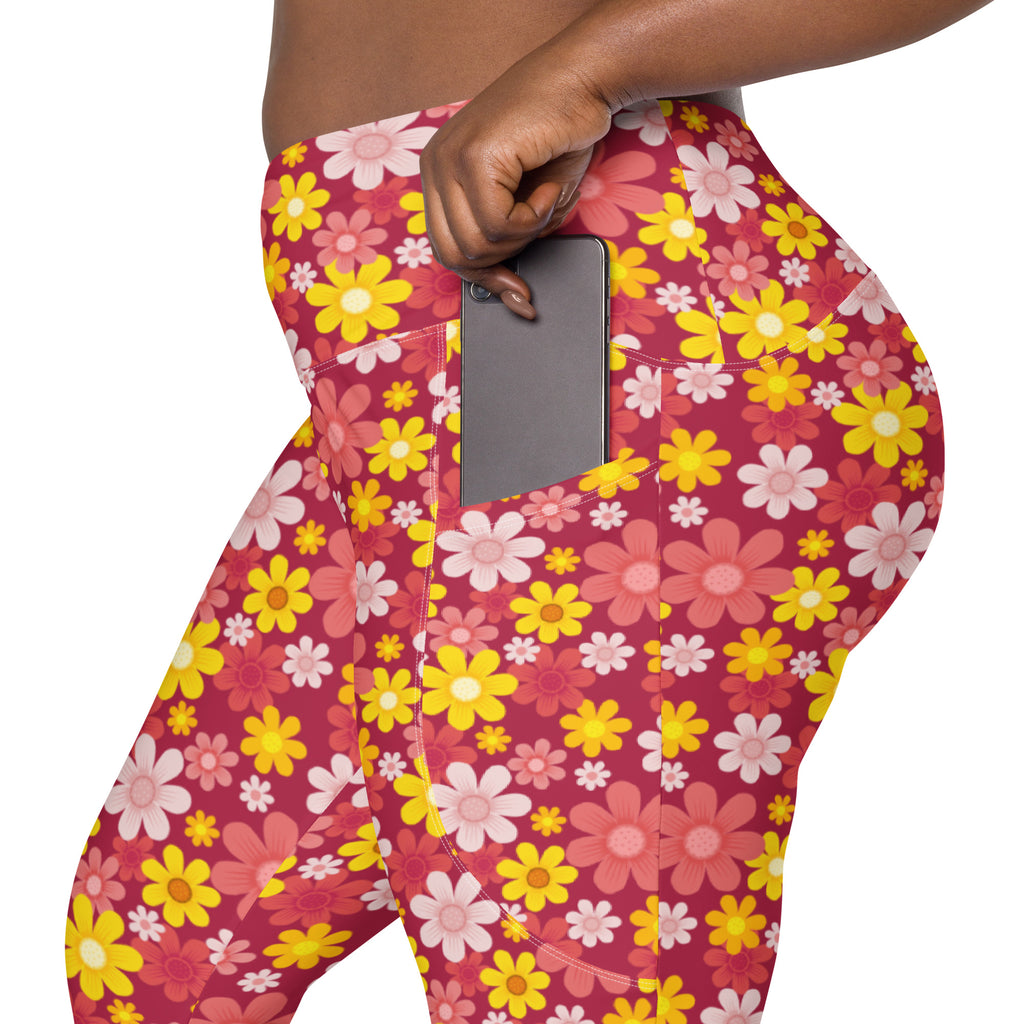 Women’s high-waisted red floral yoga leggings with pockets featuring vibrant pink yellow and white snug fit patterns