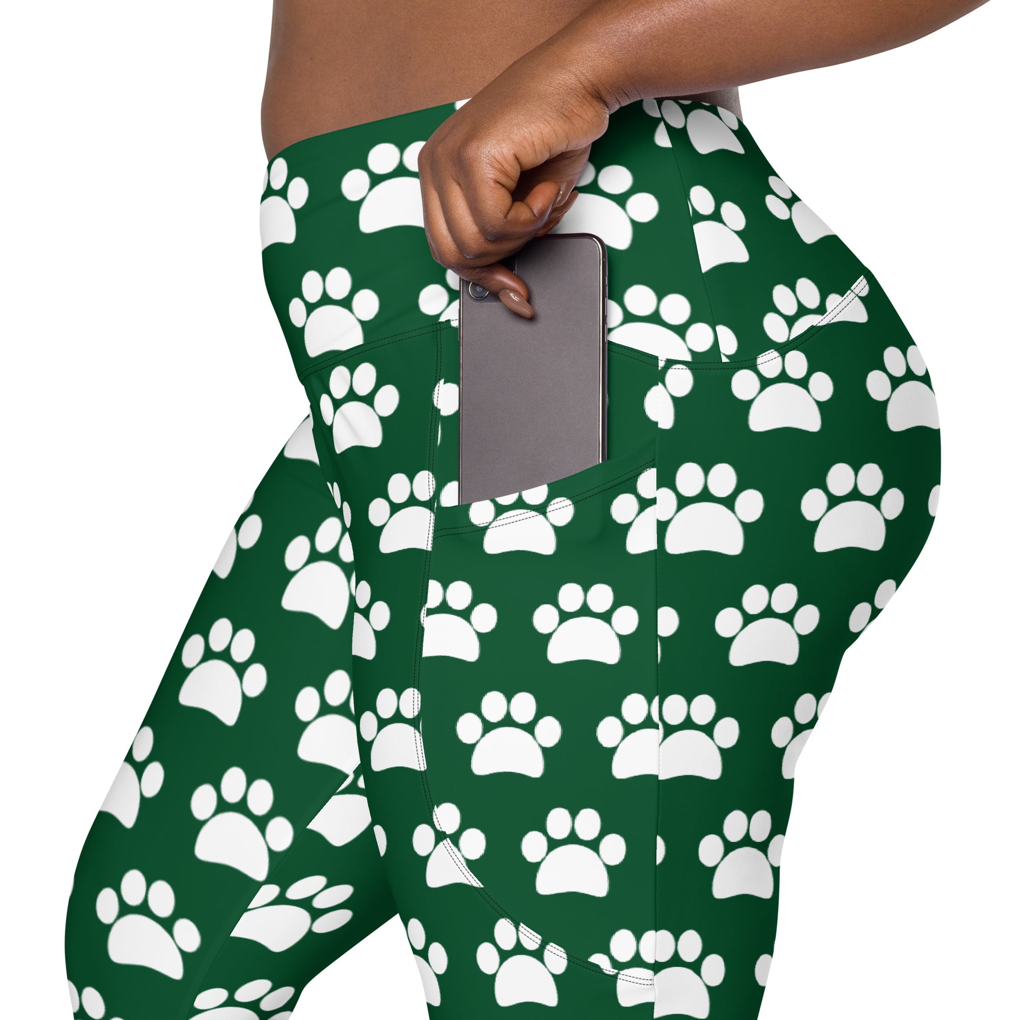 Women’s green high-waisted yoga leggings with white paw print pattern soft compression and pockets for active wear