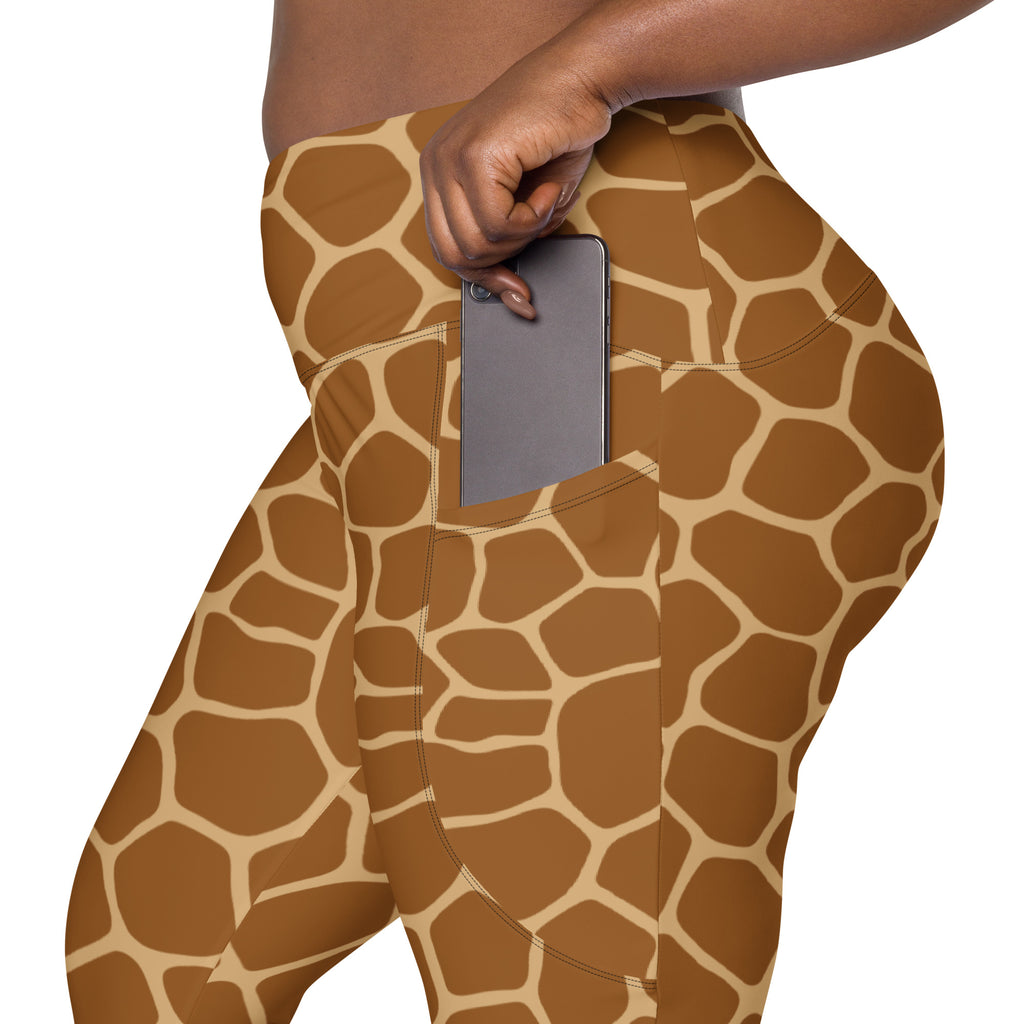 Women’s giraffe print high-waisted soft compression leggings in brown and cream with a side pocket holding a smartphone