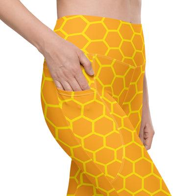 Bright yellow women’s high-waisted honeycomb yoga leggings with soft compression and pockets for active wear
