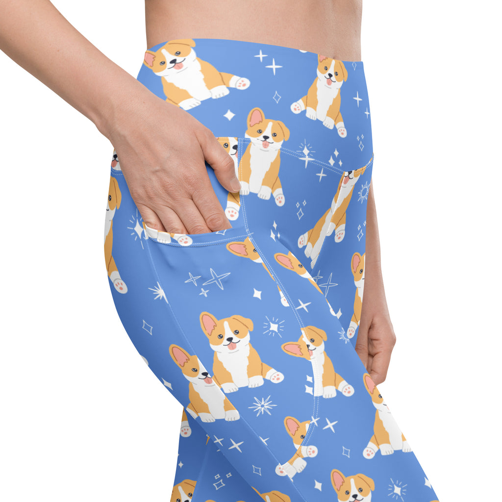 Women’s blue high-waisted corgi dog yoga leggings with pockets featuring cartoon puppies and starburst pattern