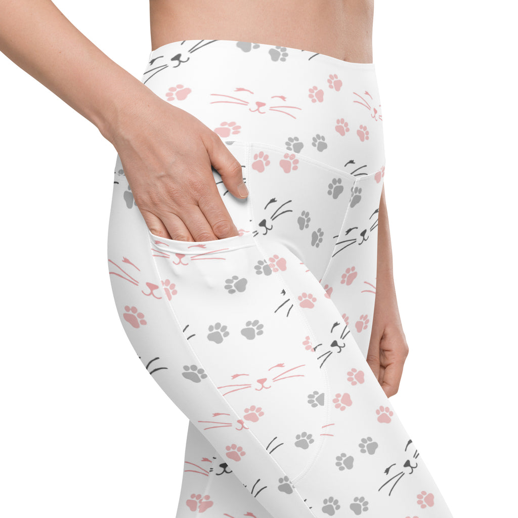 White high-waisted women’s cat paw print yoga leggings with pockets featuring soft compression fabric and playful pink and gray cats