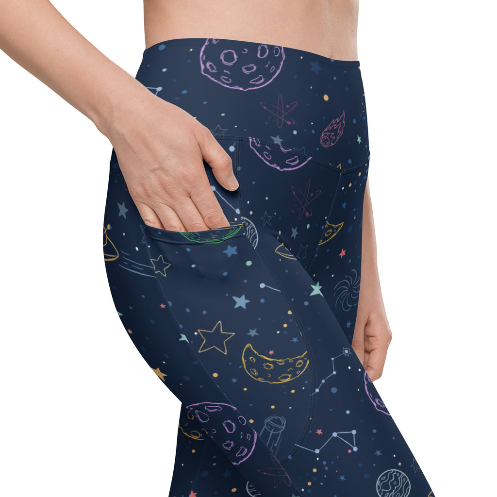 Women’s dark blue space-themed galaxy yoga leggings with colorful moons stars constellations high-waisted pockets