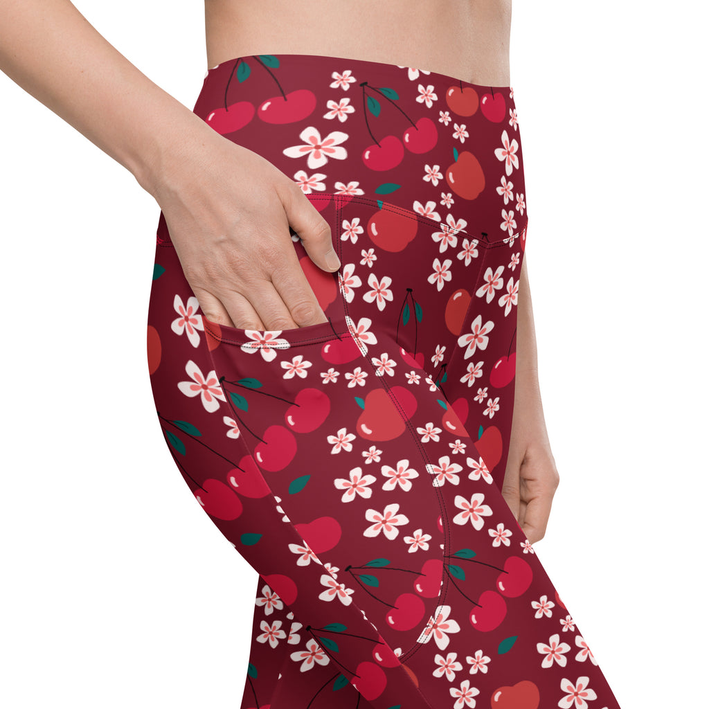 Women’s high-waisted maroon cherry blossom yoga leggings with pockets featuring vibrant red cherries and pink blossoms