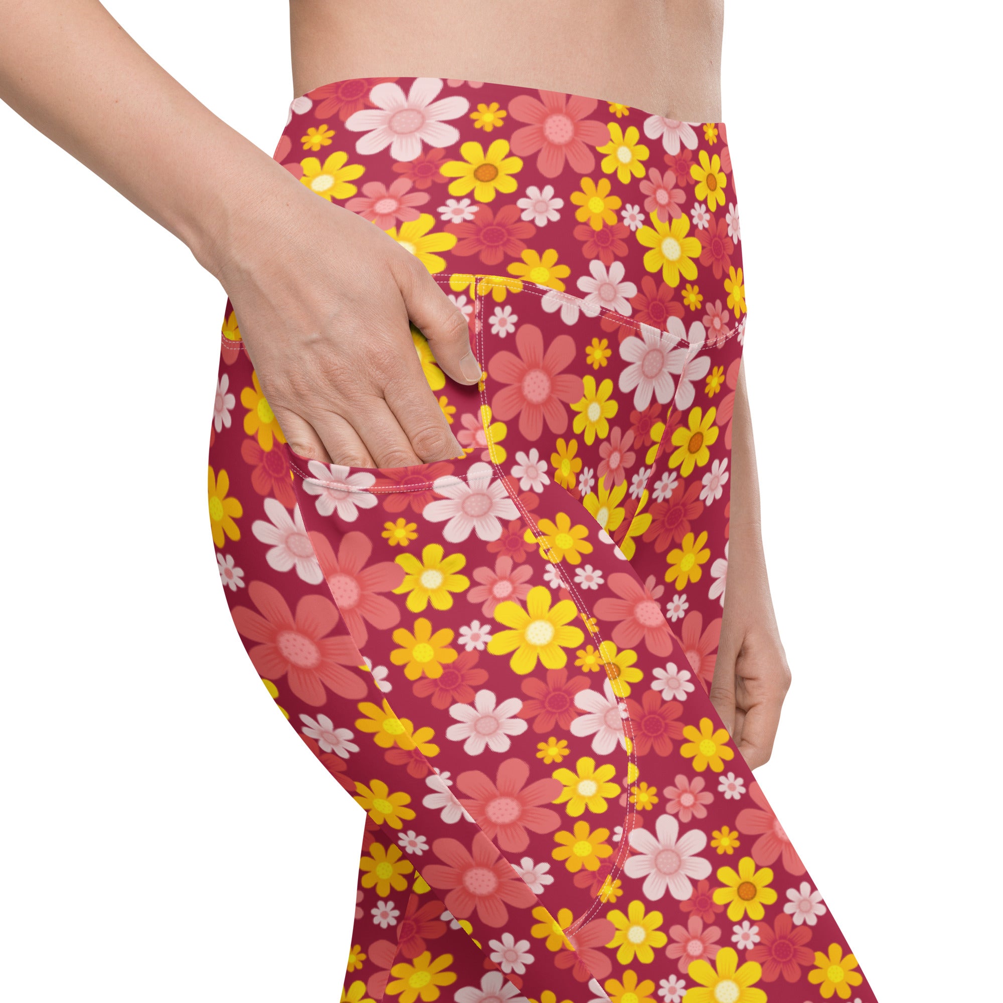 Women’s red floral yoga leggings with pockets featuring vibrant pink yellow and white high-waisted compression pants
