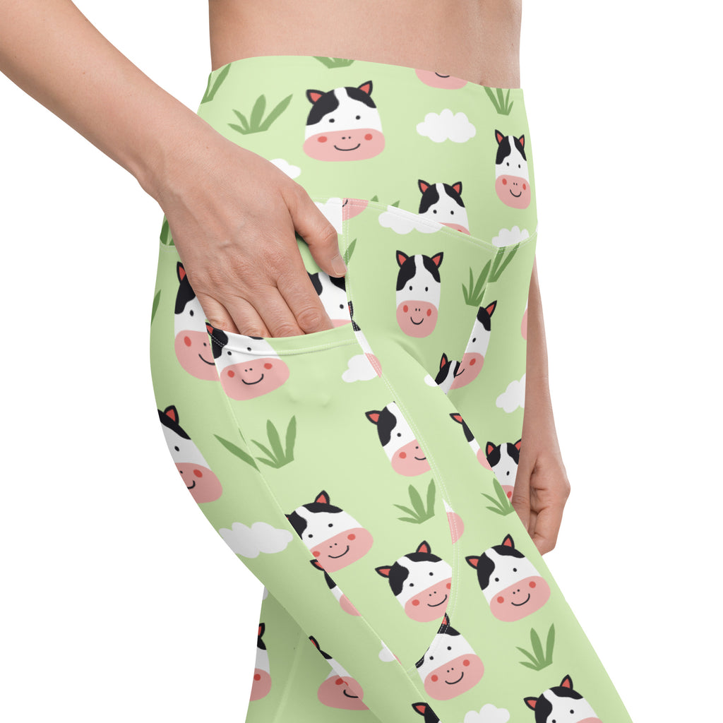 Light green women’s cute cow yoga leggings with pockets high-waisted soft compression and playful cartoon pattern