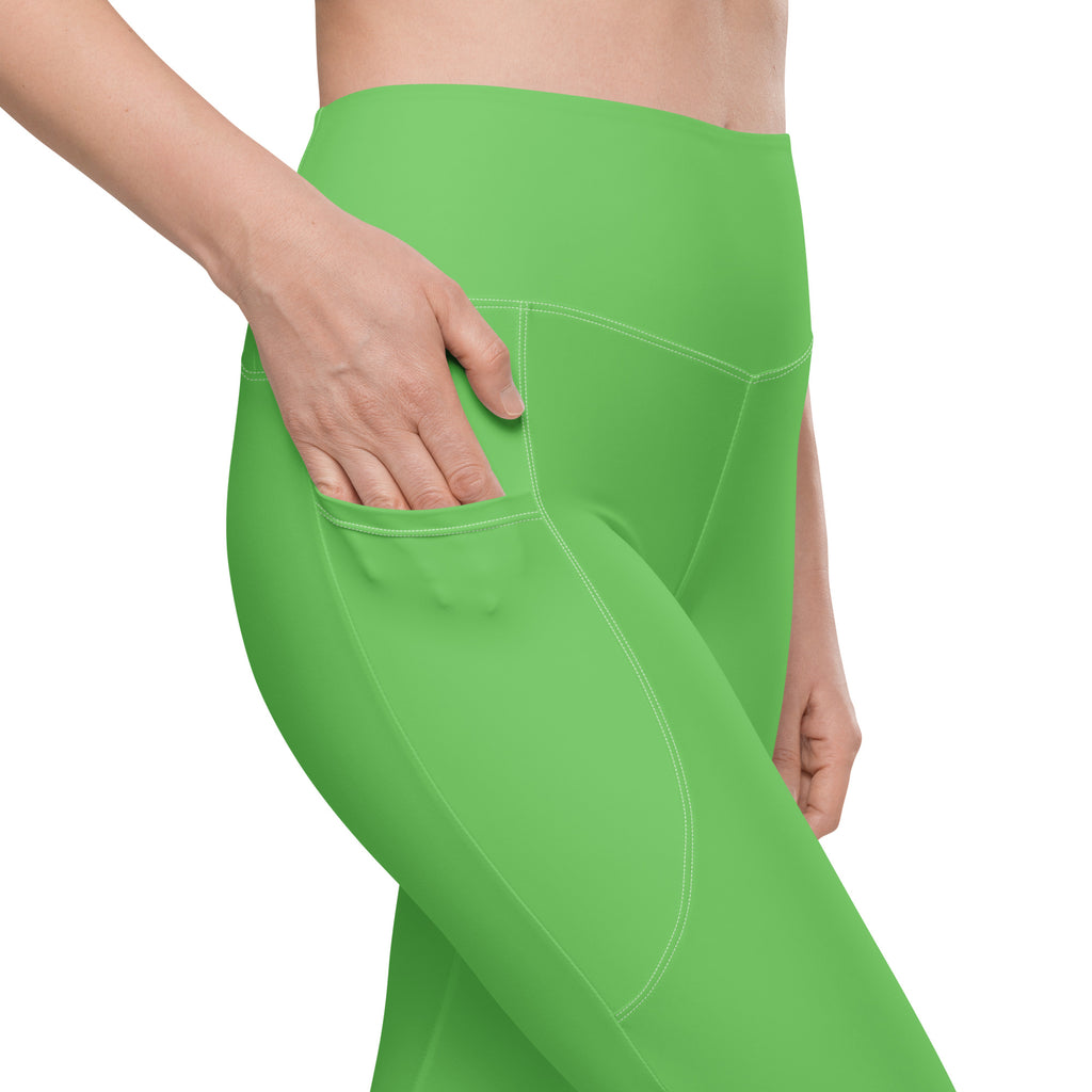 Bright green high-waisted women’s yoga leggings with side pocket soft compression and subtle seam detailing