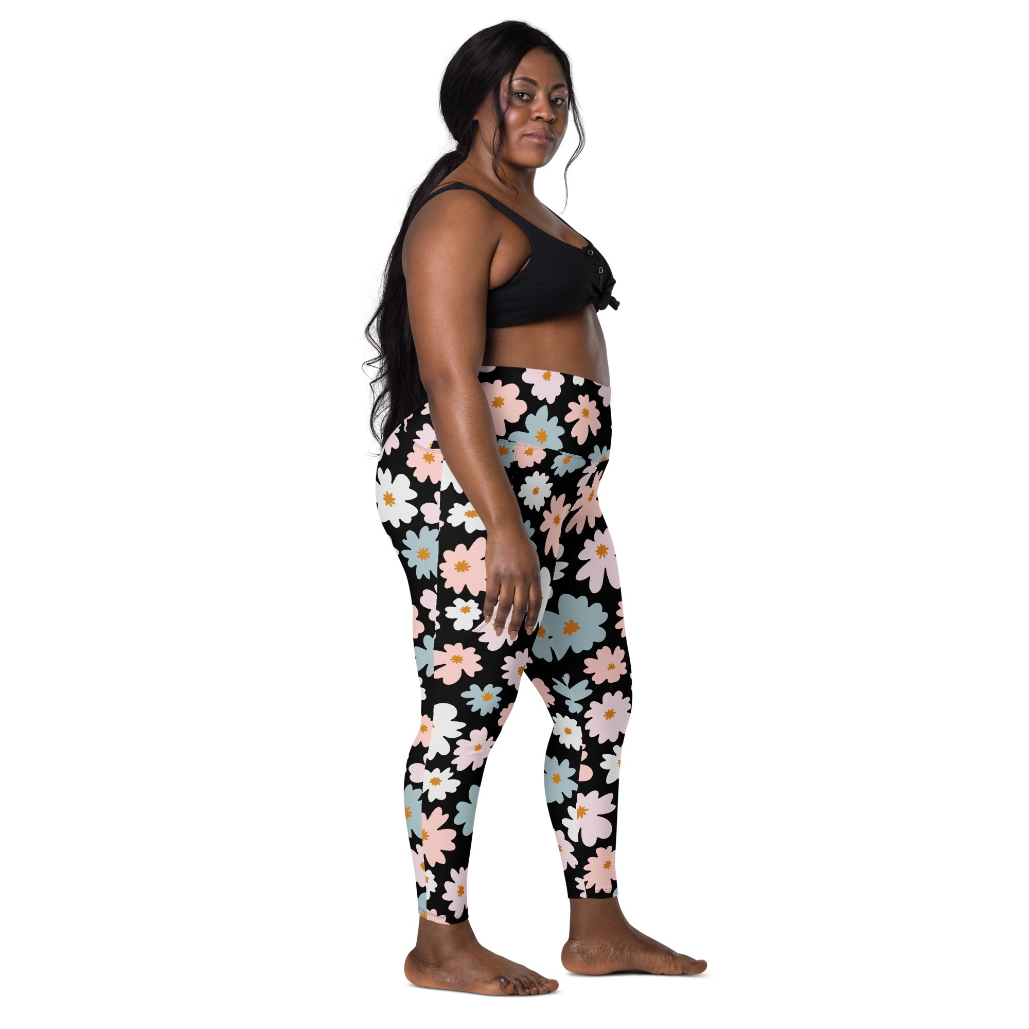 Women’s high-waisted black leggings with vibrant pink white and blue floral pattern soft compression and pockets
