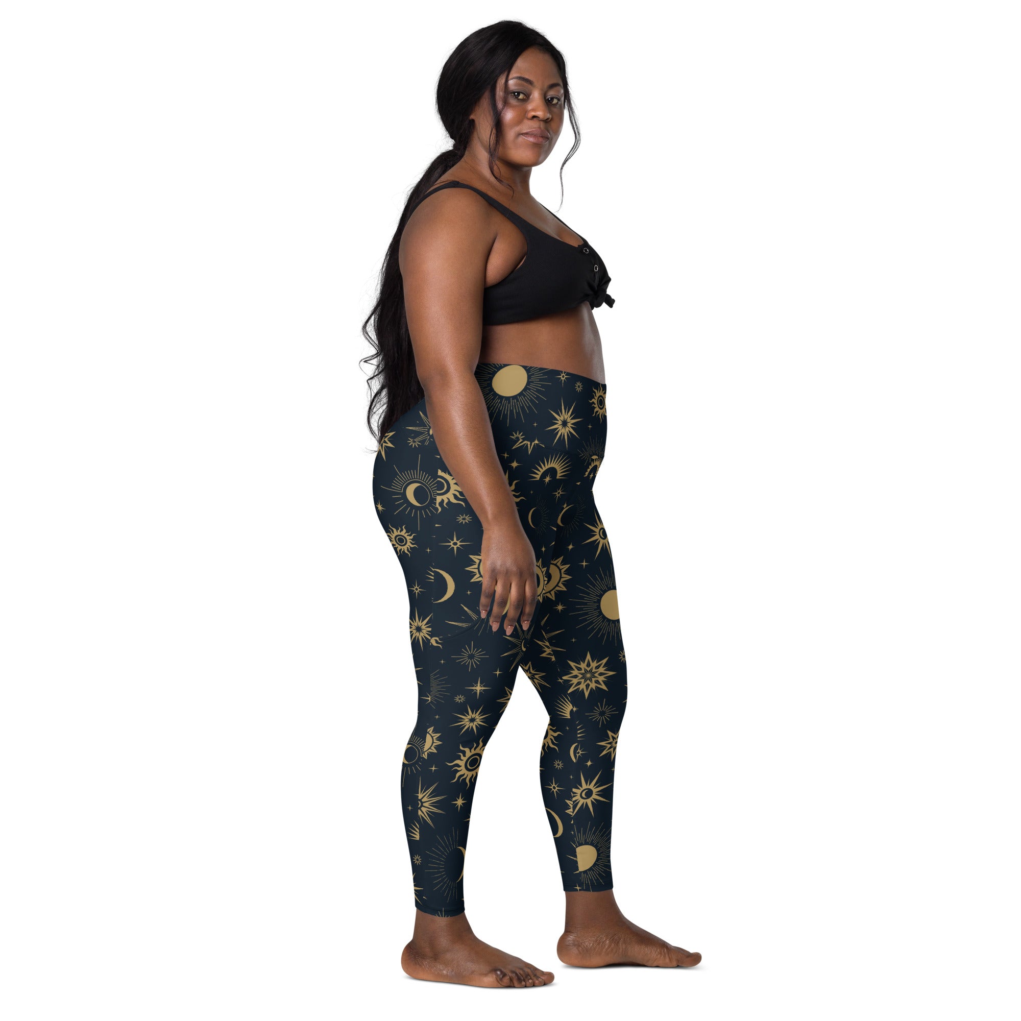 Dark blue high waisted women’s yoga leggings with vibrant gold sun moon and star celestial pattern and pockets