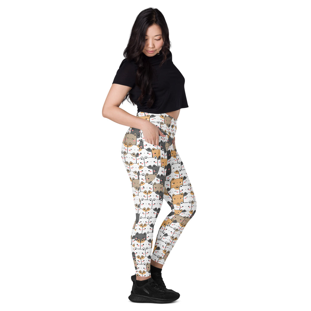 White women’s kawaii cat yoga leggings with pockets featuring a colorful cartoon cat pattern and soft compression fabric