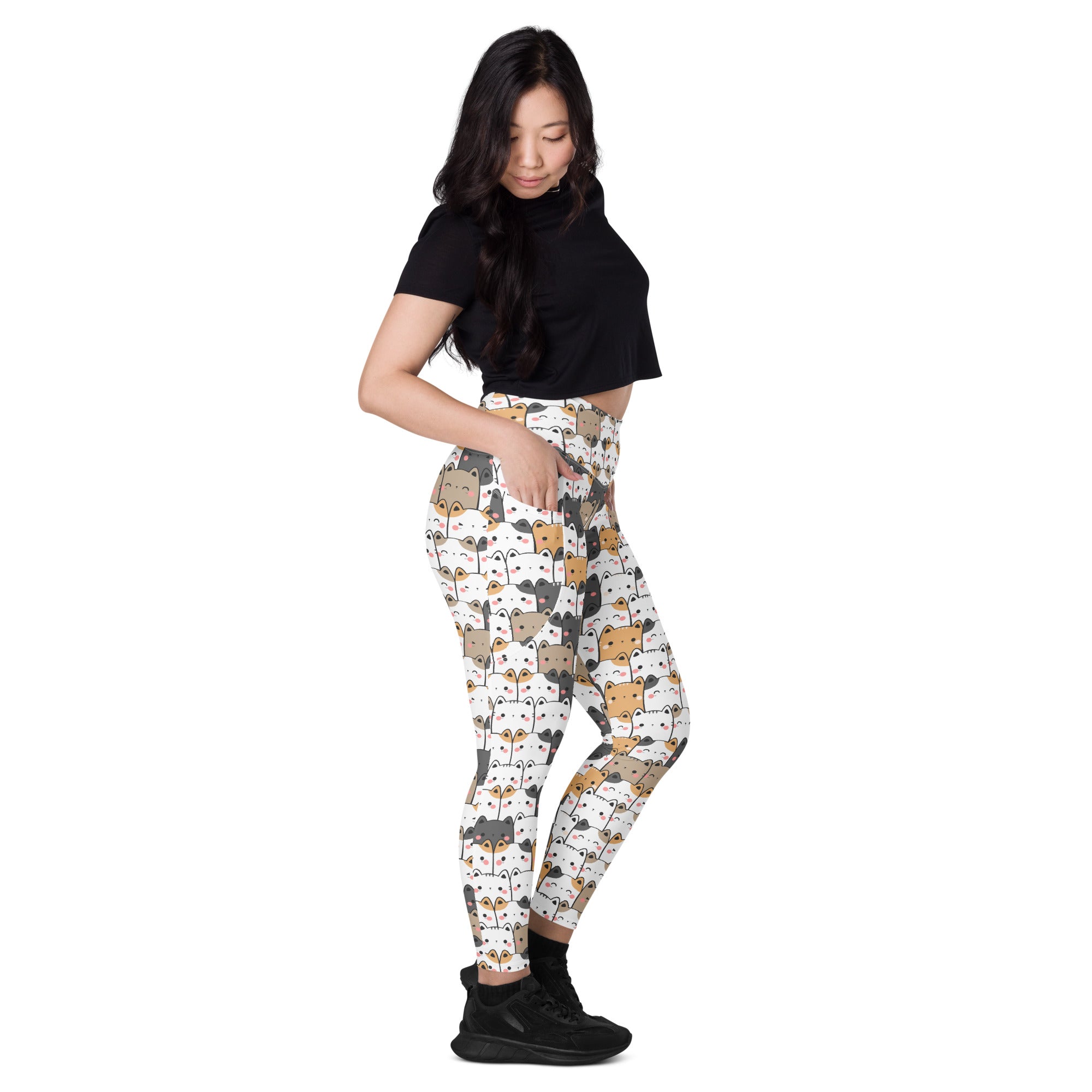 White women’s kawaii cat yoga leggings with pockets featuring a colorful cartoon cat pattern and soft compression fabric