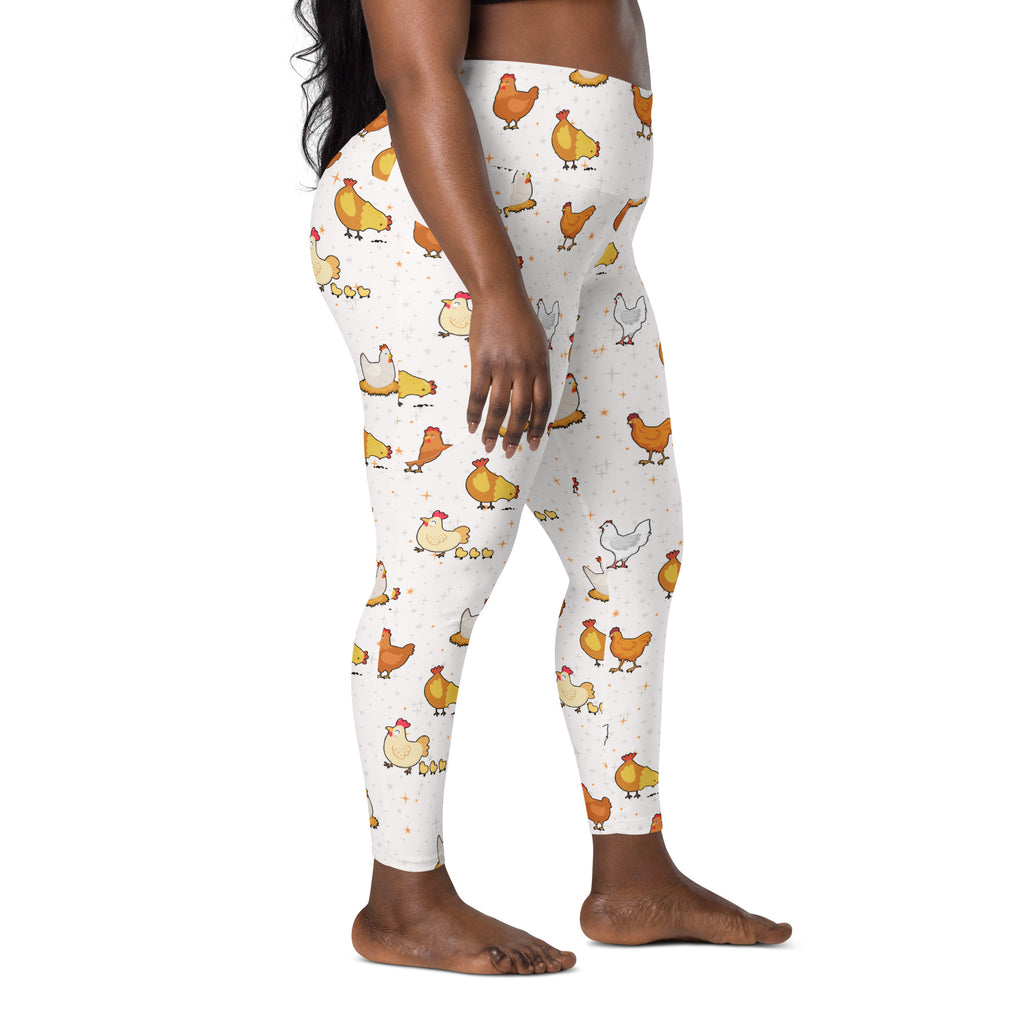 White high-waisted women’s chicken yoga leggings with soft compression and pockets featuring playful orange yellow cartoon chickens