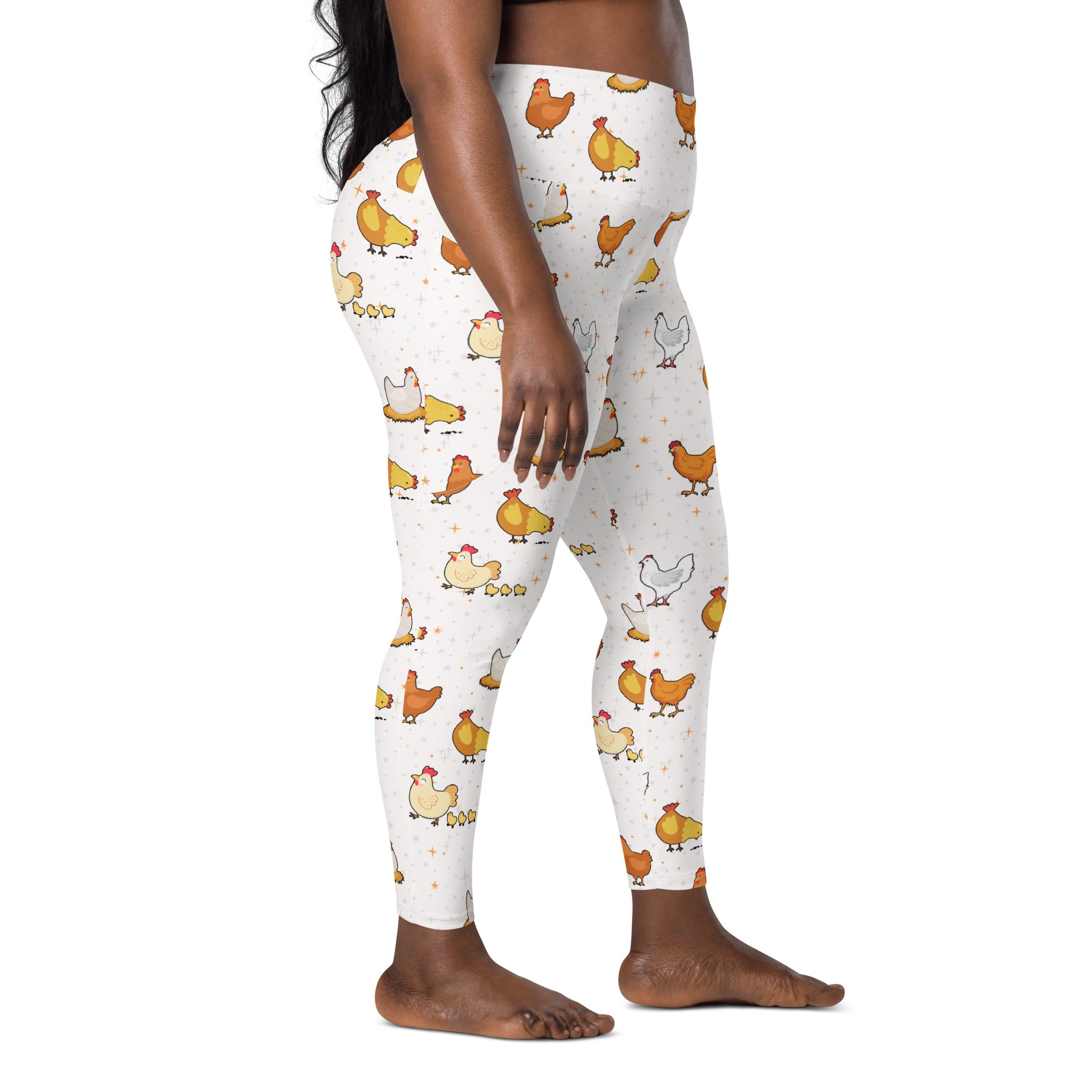 White high-waisted women’s chicken yoga leggings with soft compression and pockets featuring playful orange yellow cartoon chickens