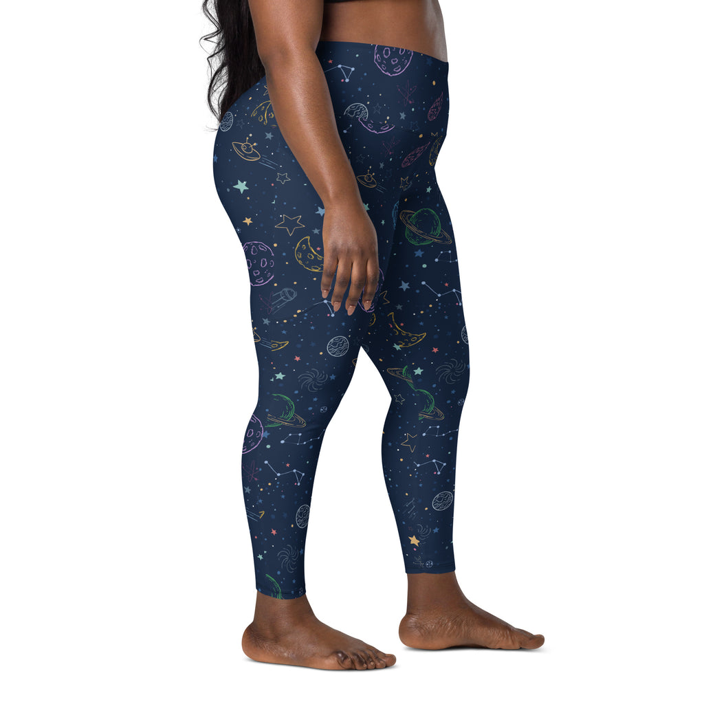 Women’s dark blue space-themed galaxy yoga leggings with high-waist, pockets, soft compression, and pastel planet prints