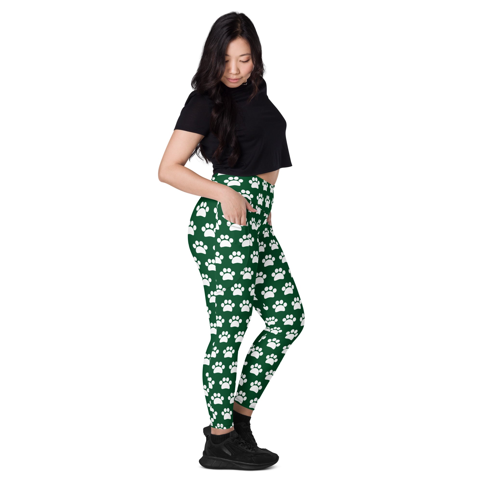 Women’s green high waisted yoga leggings with white paw print pattern soft compression fabric and pockets