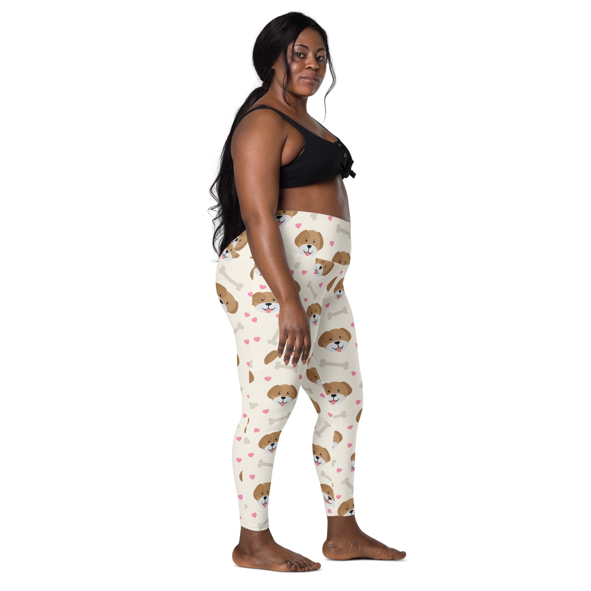 Cream-colored women’s cute dog yoga leggings with pockets featuring brown puppy faces and pink hearts print