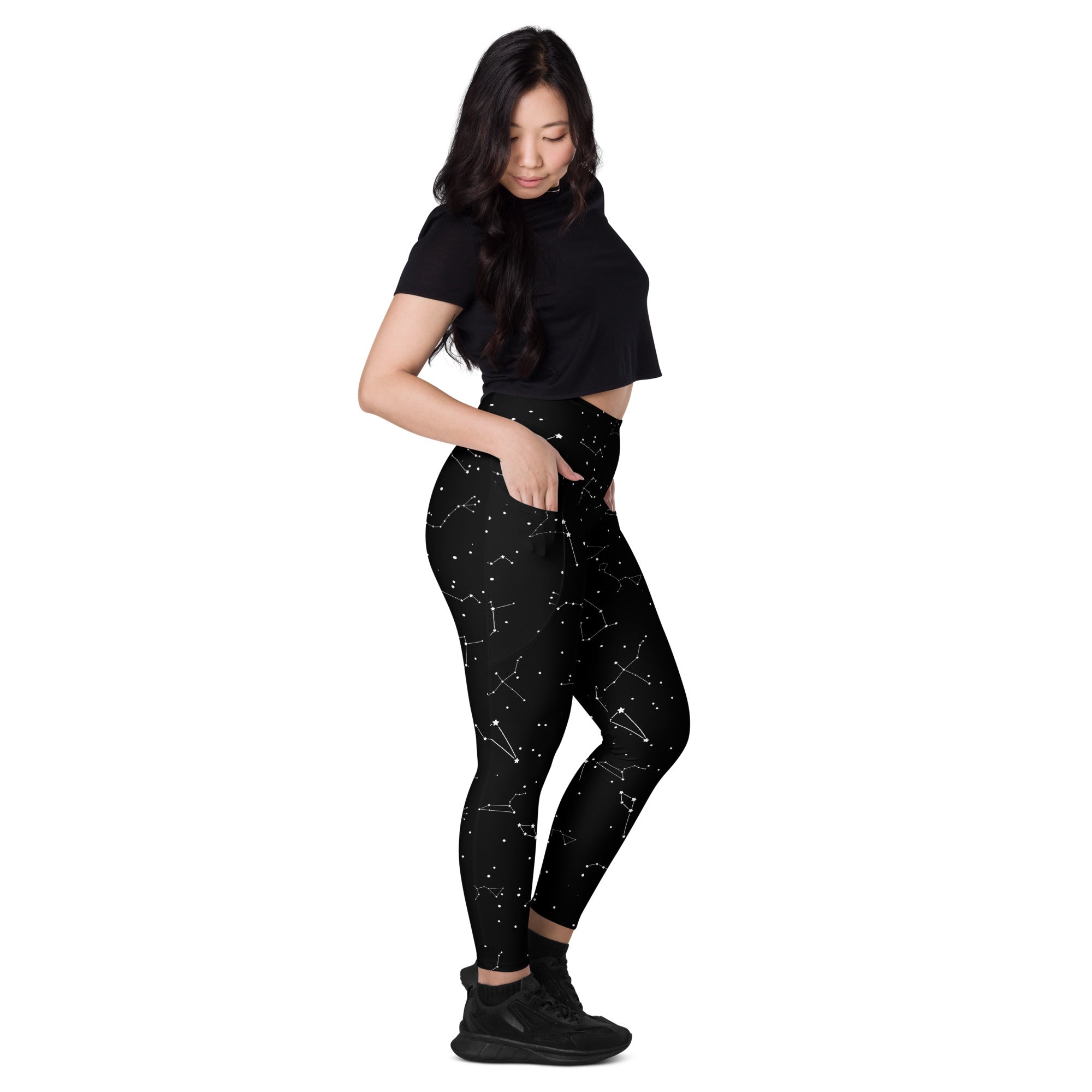 Black high-waisted leggings with white constellation pattern soft compression fabric and pockets for yoga and activewear