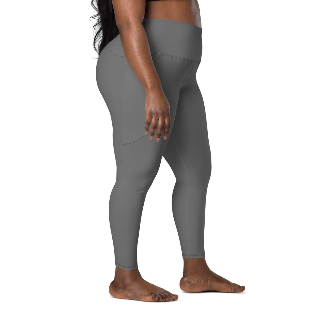 Women’s gray high-waisted yoga leggings with pockets made of smooth stretchy fabric with subtle side seam detailing