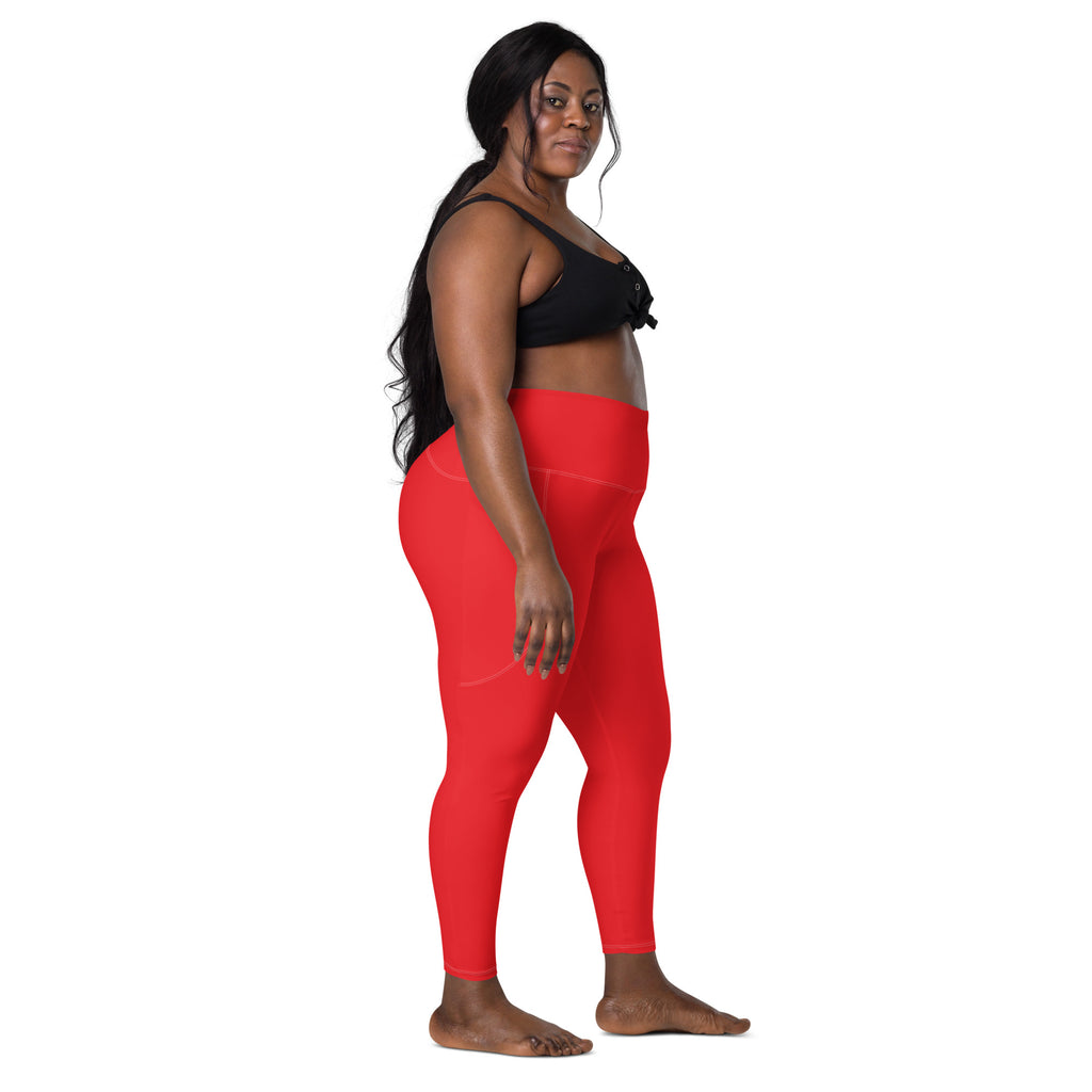 Bright red high-waisted women’s yoga leggings with pockets made of soft stretchy compression fabric