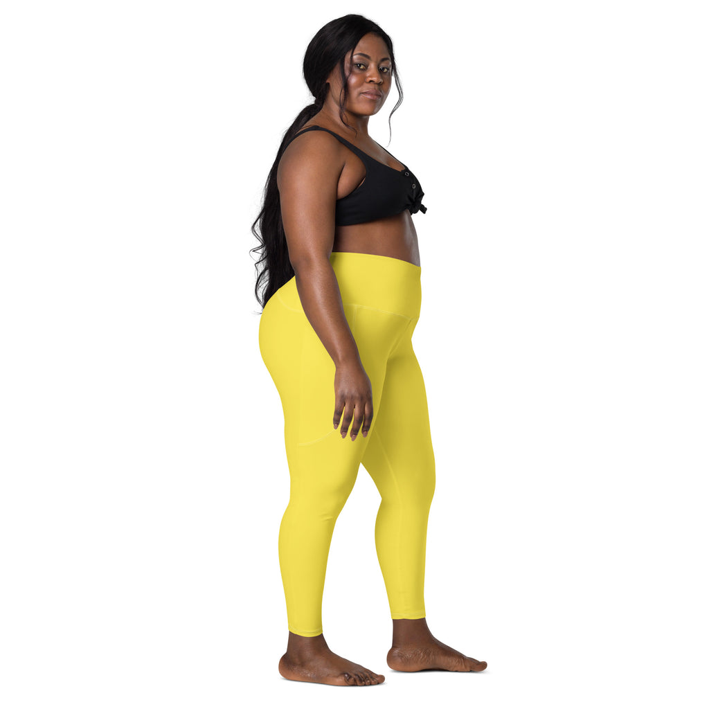 Women’s bright yellow high-waisted yoga leggings with pockets soft compression fabric for activewear use
