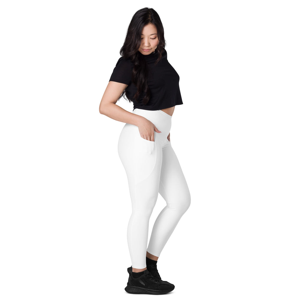 Women’s white high-waisted yoga leggings with pockets featuring a sleek, form-fitting design and soft compression fabric