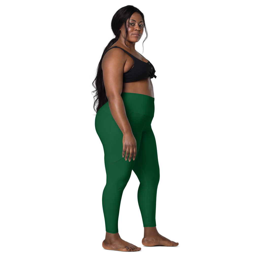 Women’s dark green high-waisted yoga leggings with pockets made of soft compression fabric for active wear