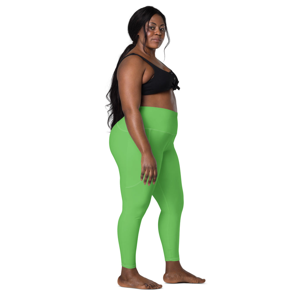 Women’s bright green high-waisted yoga leggings with pockets made of soft compression fabric for activewear