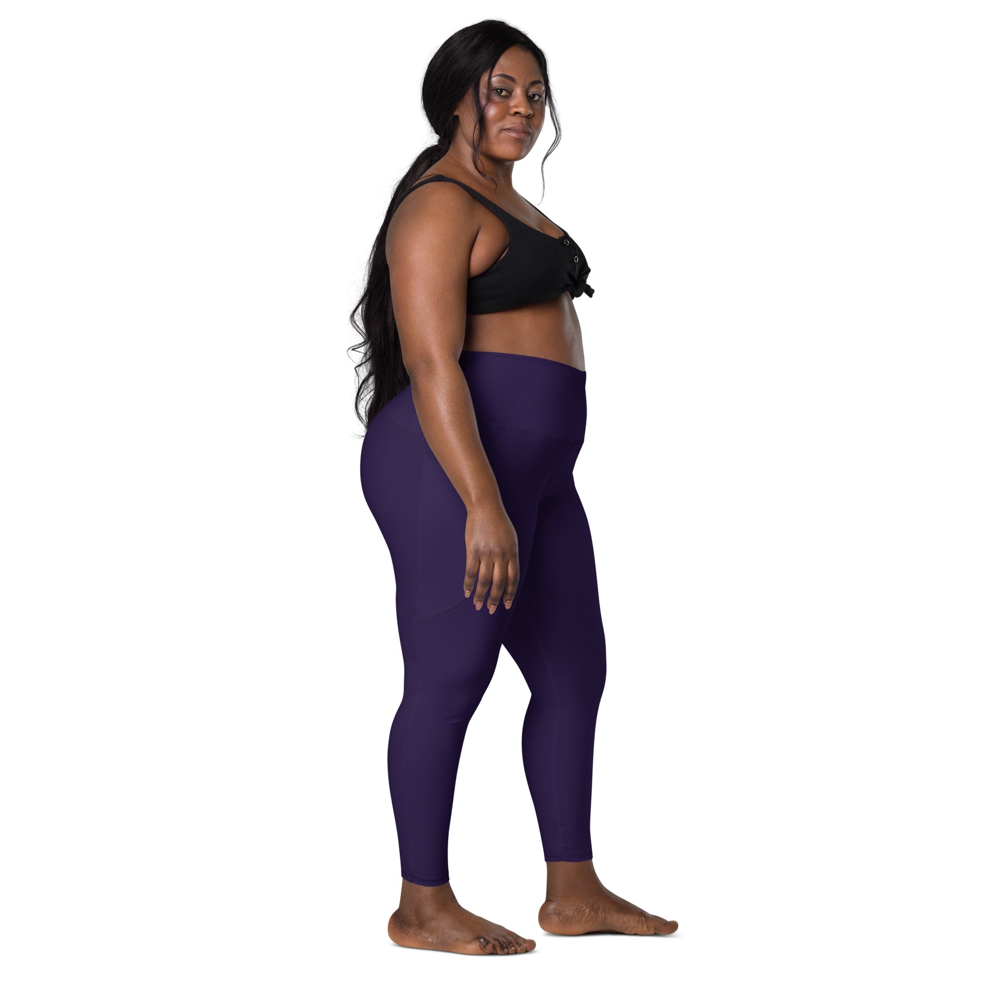 Women’s dark purple high-waisted yoga leggings with pockets made of soft compression fabric for activewear