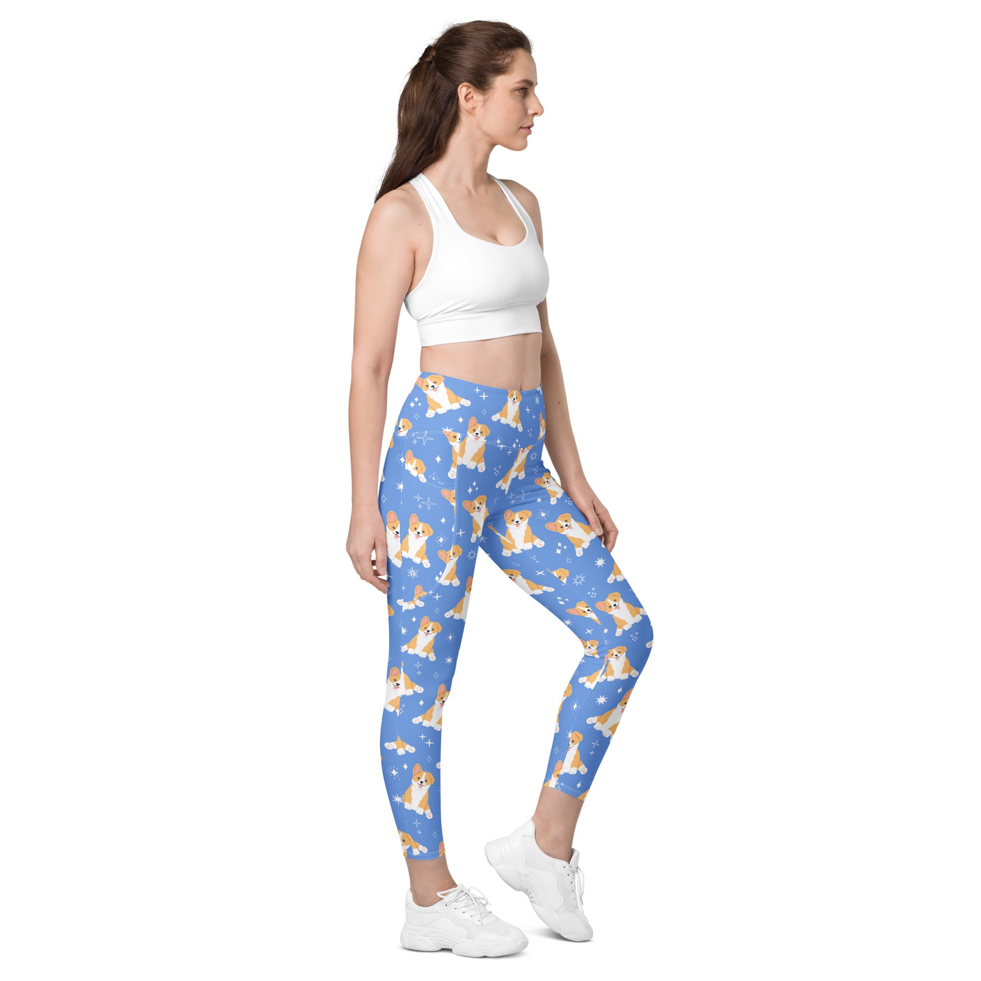 Women’s blue high-waisted corgi dog yoga leggings with pockets featuring tan and white corgis and star accents