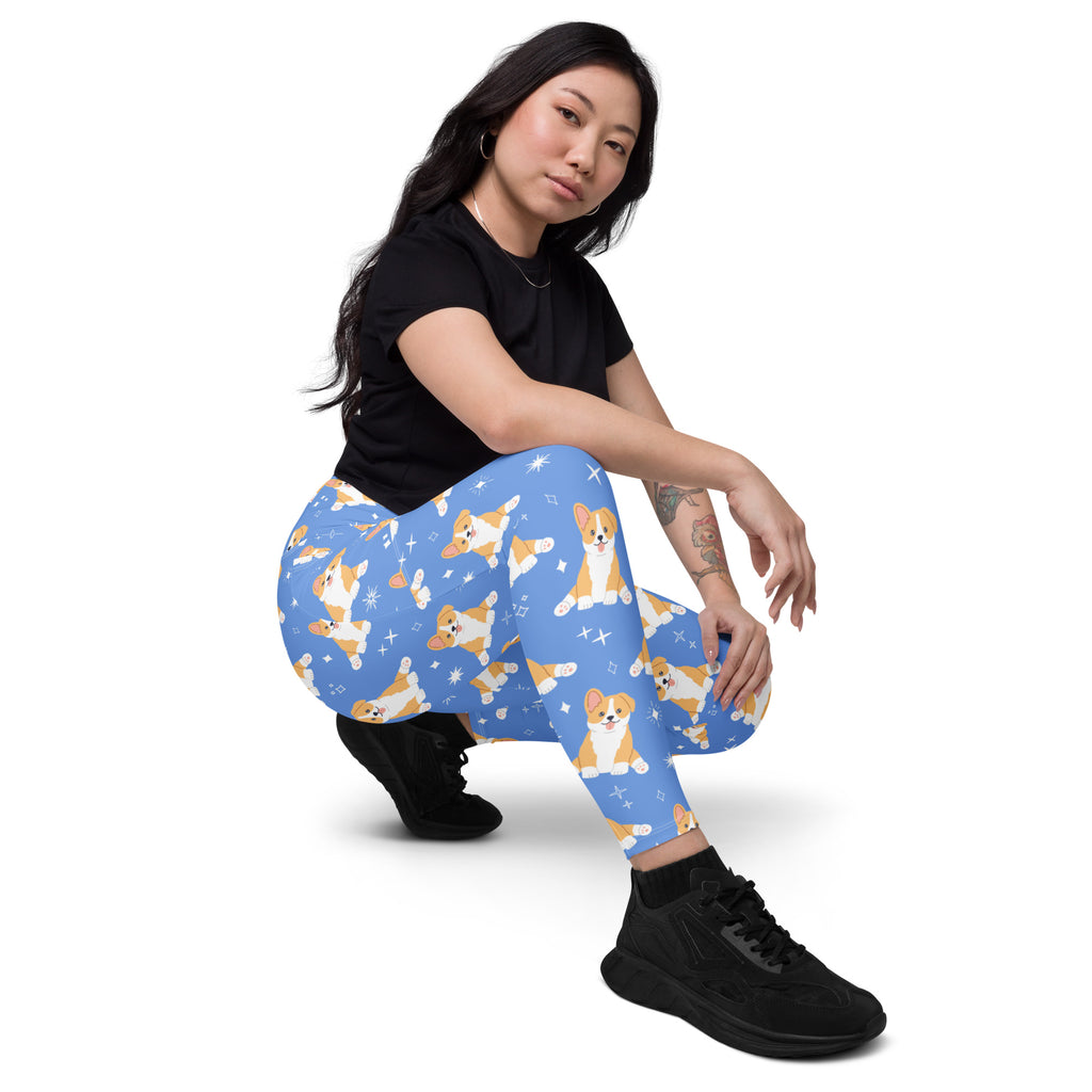 Women’s blue high-waisted yoga leggings with pockets featuring a playful corgi and sparkle pattern in soft compression fabric