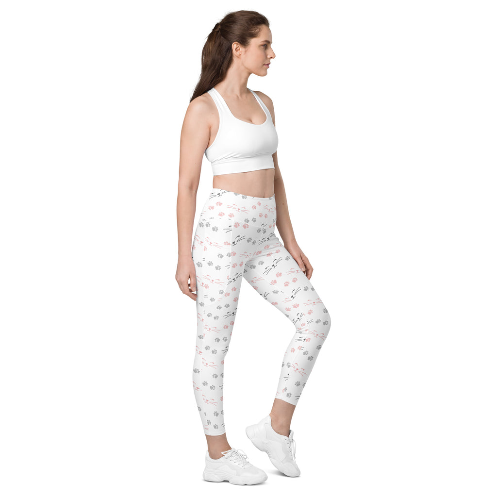 White high-waisted cat paw print yoga leggings with pockets featuring soft compression and gray pink paw patterns
