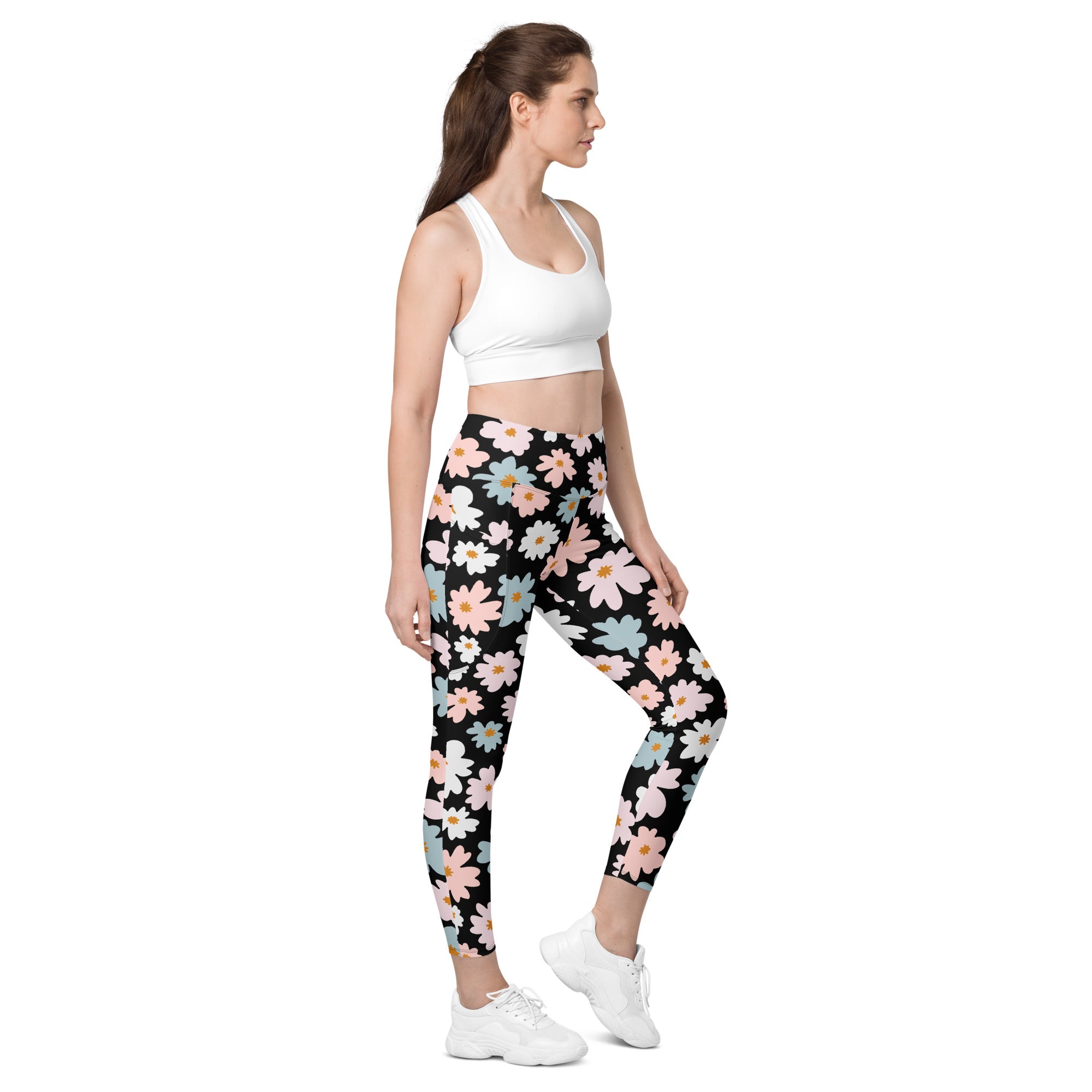 Women’s retro floral yoga leggings with pockets in black featuring pink white and light blue blossoms and soft compression