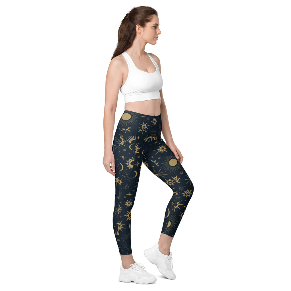 Dark blue women’s celestial sun and moon high-waisted yoga leggings with pockets and soft compression fabric