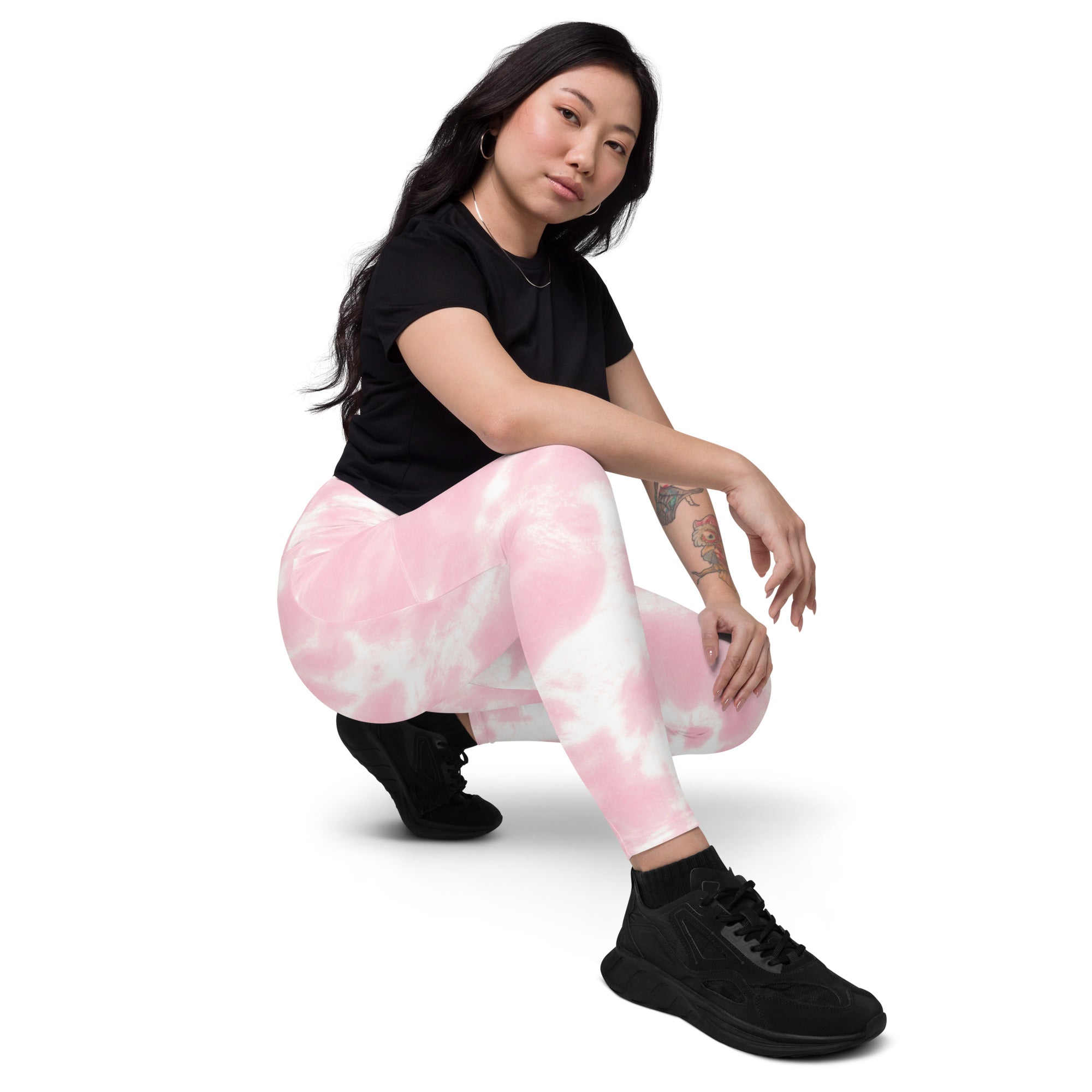 Women’s pink and white tie dye yoga leggings with high waisted soft compression fabric and pockets shown from the back