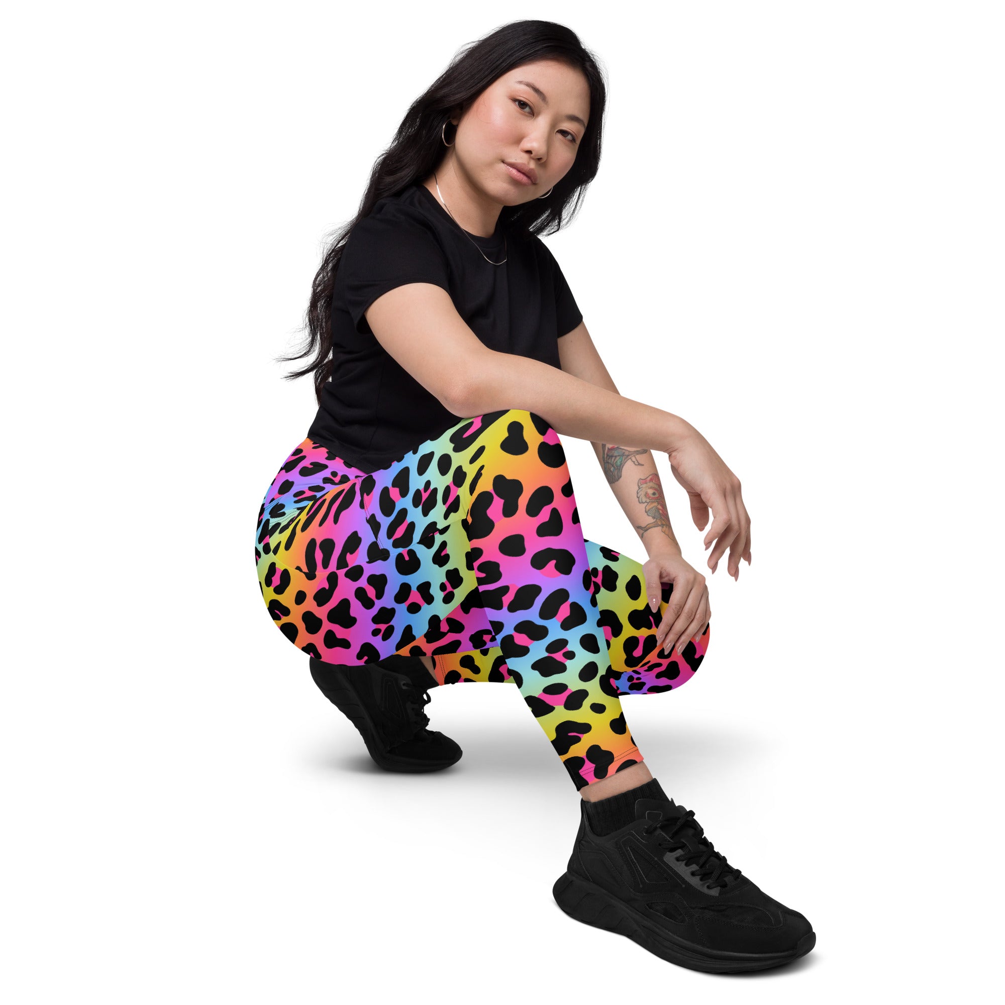Women’s high-waisted rainbow leopard yoga leggings with pockets featuring stretchy soft compression fabric