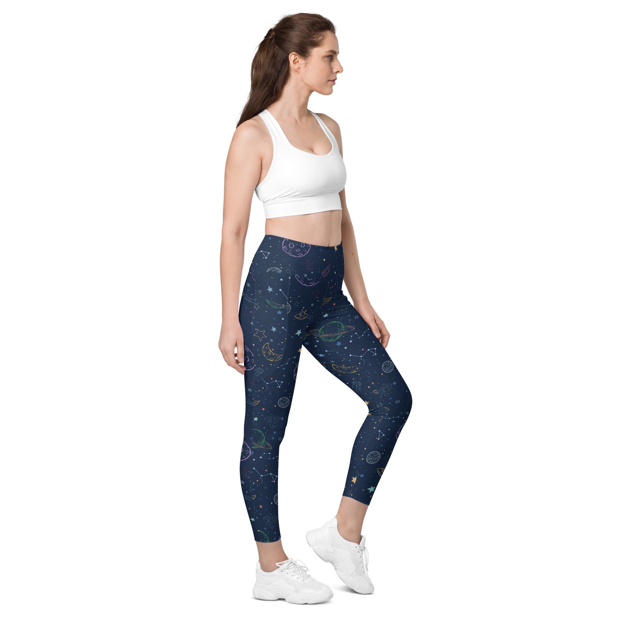 Women’s dark blue celestial-themed high-waisted yoga leggings with soft compression and embroidered pastel planets stars and constellations