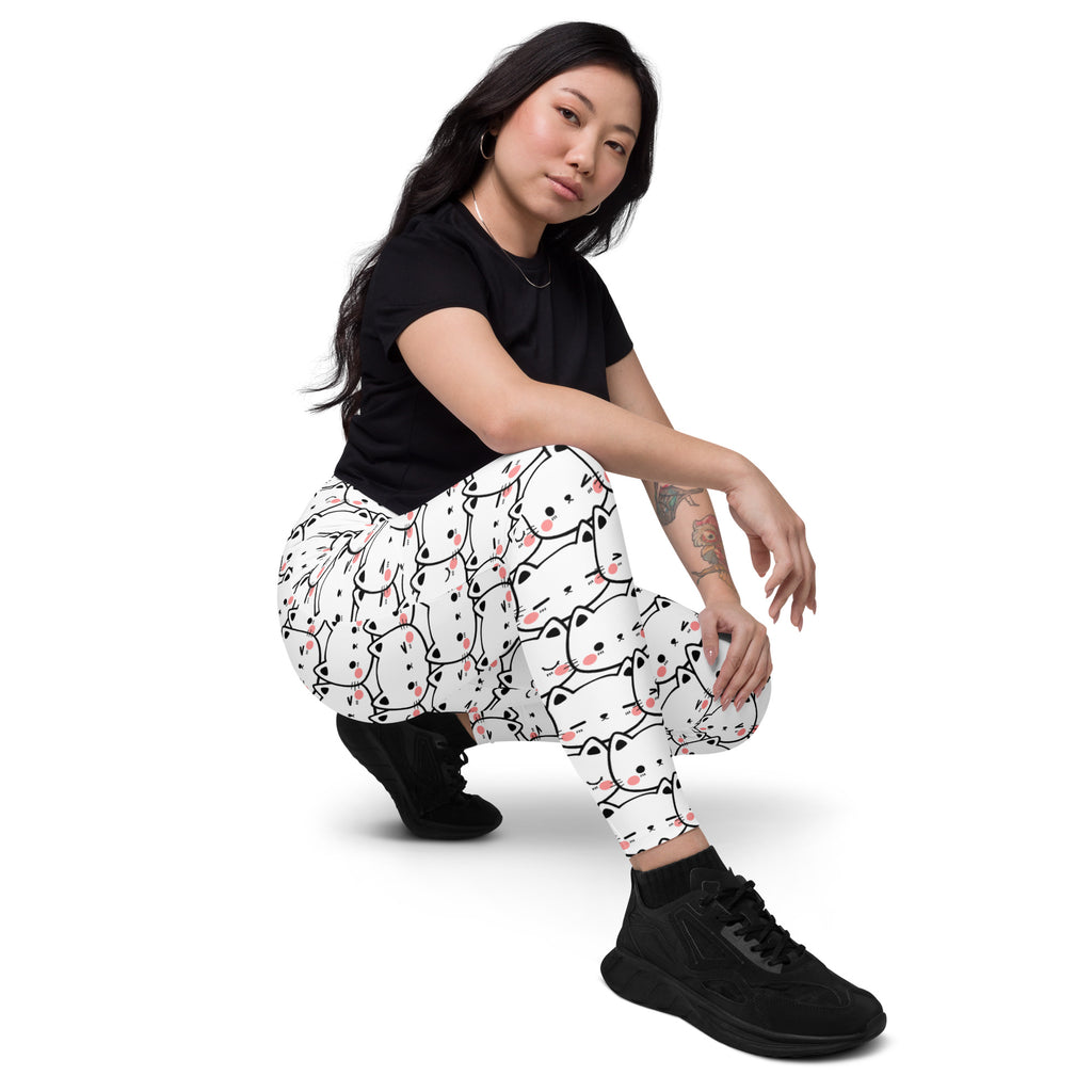 Women’s white high-waisted kawaii cat face yoga leggings with pockets featuring black outlined cartoon cats with pink cheeks