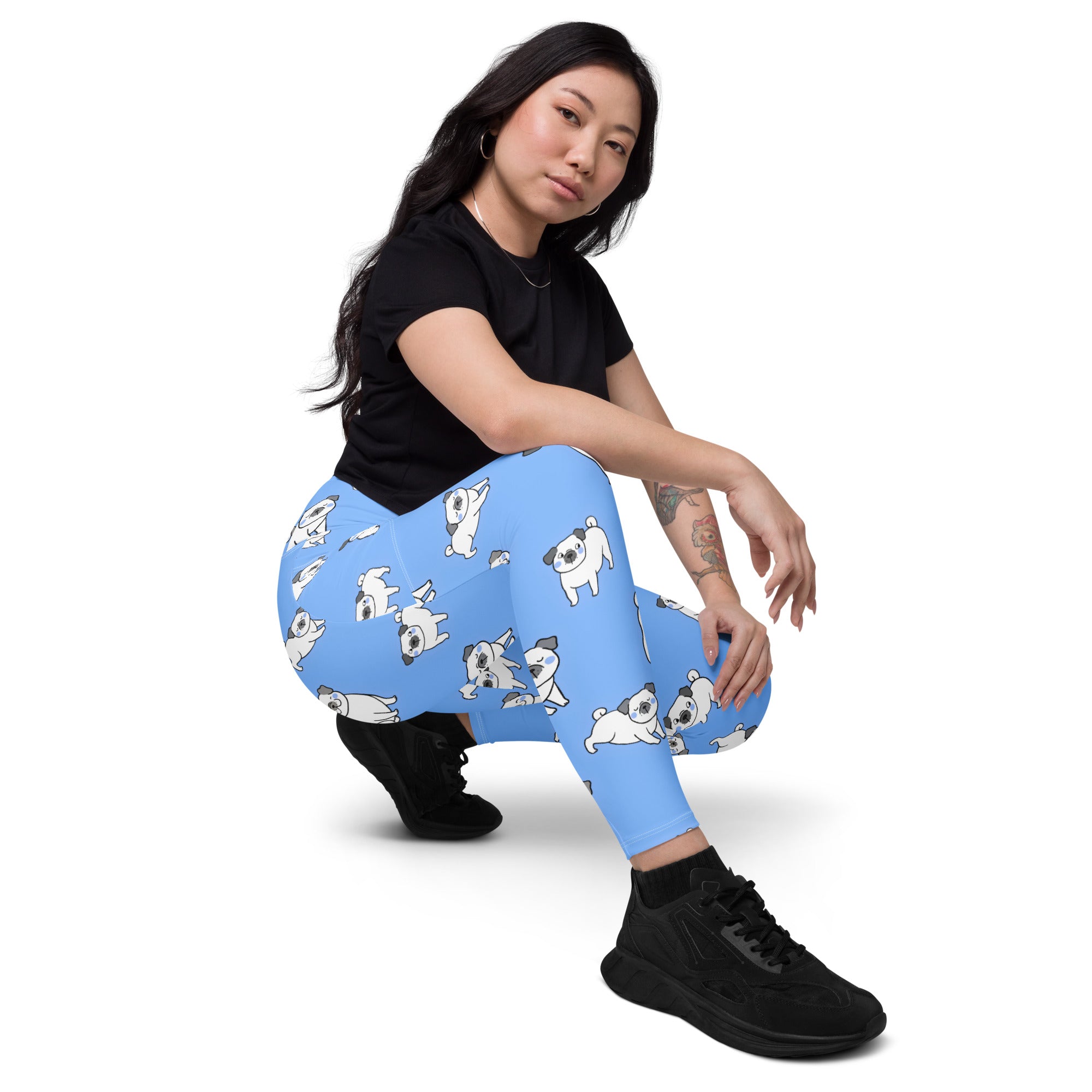 Women’s light blue high-waisted pug yoga leggings with pockets featuring soft compression and white cartoon pugs pattern