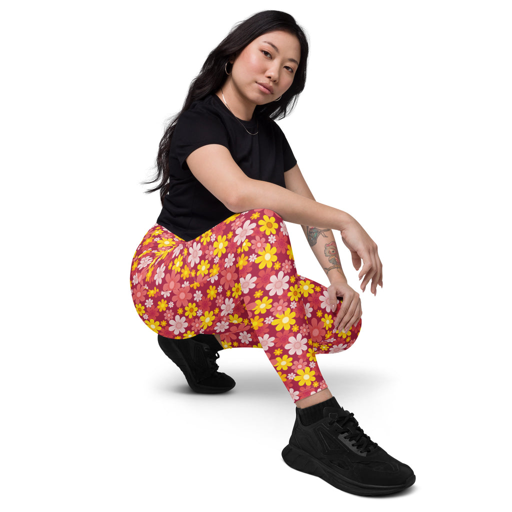Women’s high-waisted red floral yoga leggings with pockets featuring vibrant pink fabric and yellow white daisy pattern