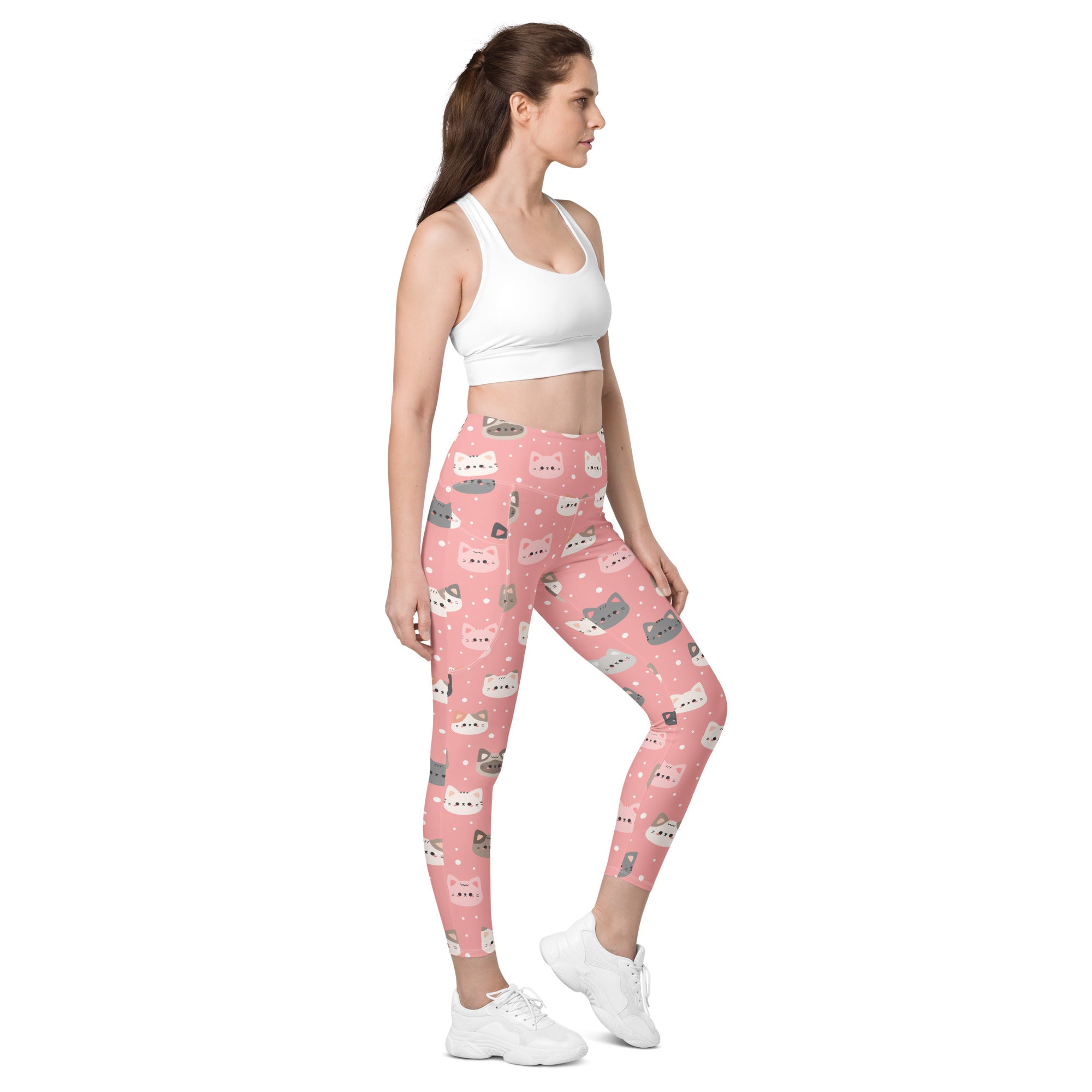 Women’s cute pink cat faces high-waisted leggings with pockets featuring playful cartoon cats and soft compression fabric