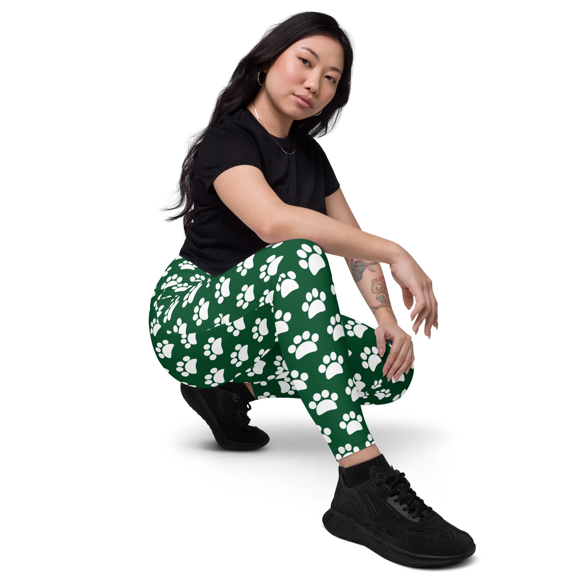 Women’s green high-waisted paw print yoga leggings with pockets soft compression fabric for active use