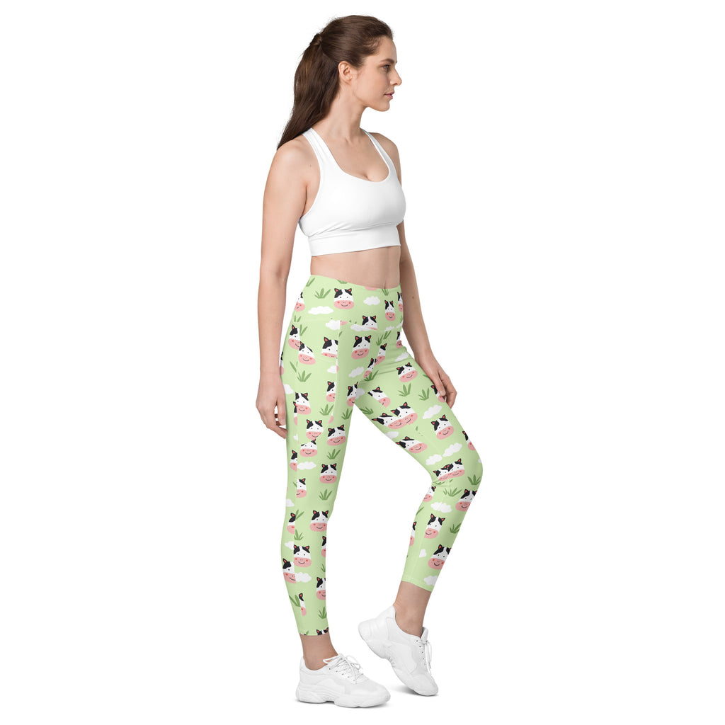 Women’s light green high-waisted cute cow yoga leggings with pockets soft compression and playful cartoon pattern