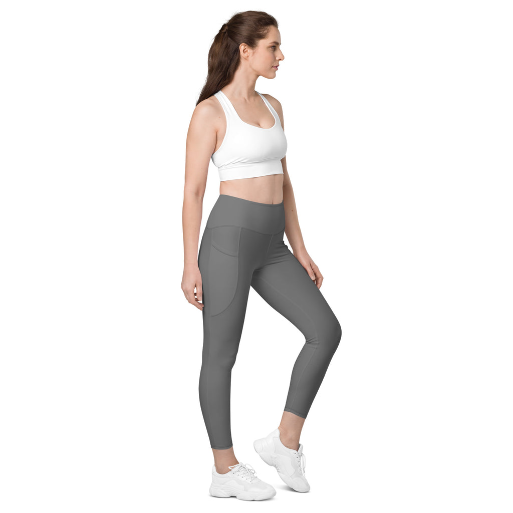 Women’s gray high-waisted yoga leggings with soft compression fabric and subtle side pockets for active wear