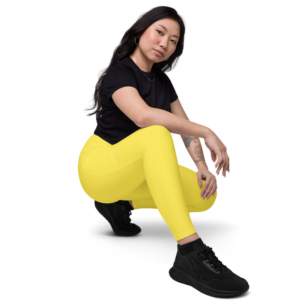 Women’s yellow high waisted yoga leggings with pockets made of smooth soft compression fabric for active wear