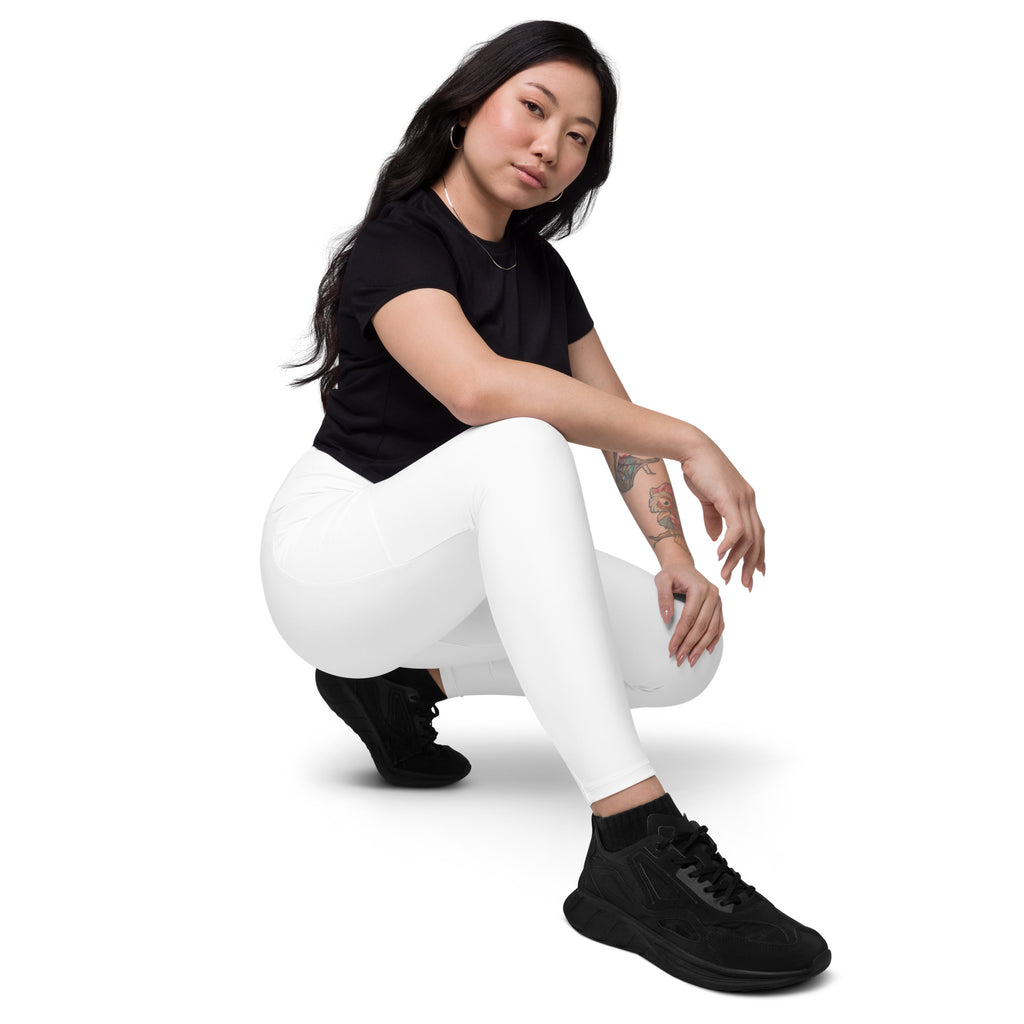 Women’s white high-waisted yoga leggings with pockets made of soft compression fabric for active wear