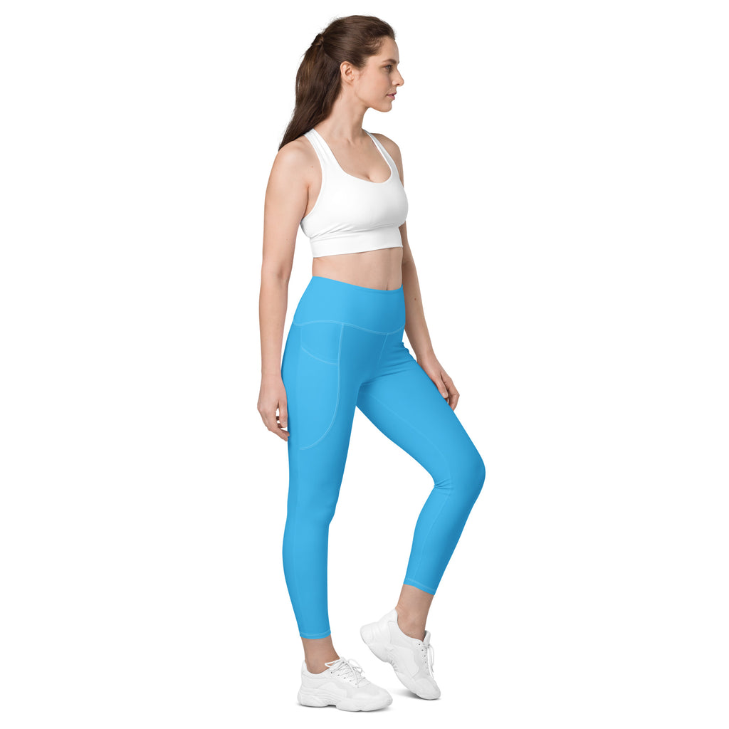 Women’s bright blue high-waisted yoga leggings with pockets made of smooth stretchy fabric and subtle side seam detailing